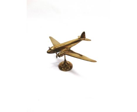 A CAST BRASS MODEL OF A DOUGLAS C-47 SKYTRAIN / DAKOTA AIRCRAFT  circa 1940s, wingspan 38.5cm.  