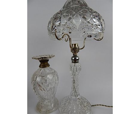 AN EARLY 20TH CENTURY CLEAR CUT GLASS TABLE LAMP  with dome shade silver plated mounts and baluster base, 44cm high, together