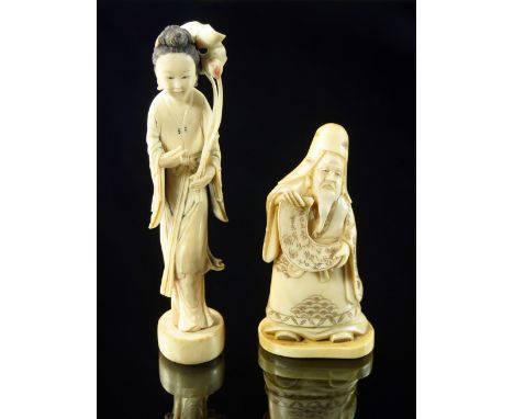 A Japanese ivory model of a sage, late 19th/early 20th century, modelled standing holding a scroll, 10.5cm high, together wit