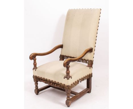 A 19TH CENTURY FRENCH ARMCHAIR with light cream striped upholstery, with fringed and studded detail, on H stretcher base, 118