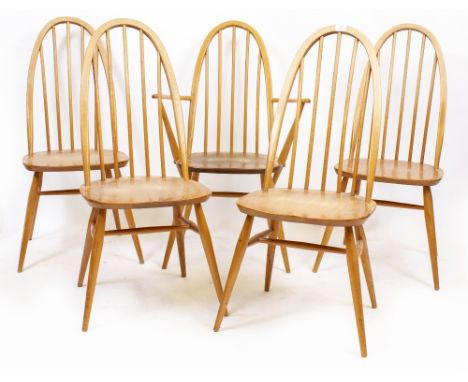 A SET OF ERCOL LIGHT ELM SPINDLE BACK CHAIRS each 102cm high, with a matched armchair (5)