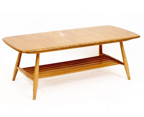 AN ERCOL STYLE LIGHT ELM COFFEE TABLE with spindle supports, 105cm wide x 45cm deep x 36cm high