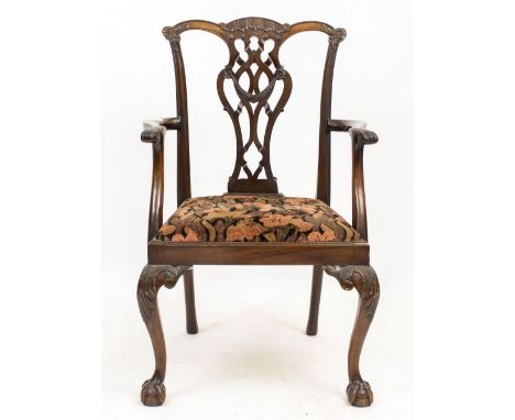 A CHIPPENDALE STYLE MAHOGANY OPEN ARMCHAIR with a pierced splat back, scrolling acanthus arms and inset seat, with cabriole f