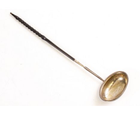 A GEORGIAN SILVER TODDY LADLE with indistinct marks for London 'TM' and indistinct date code dated to reverse 1788 with beade