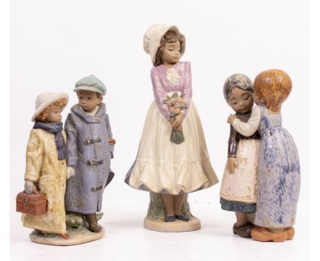 A LLADRO PORCELAIN FIGURINE model number 2242 'Away to School', 27.5cm high; a further Lladro porcelain figurine of children 