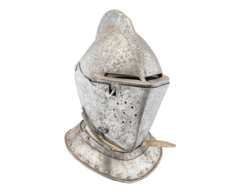 with rounded one-piece skull rising to a high boldly roped comb (its crest slightly damaged at two points), pierced over each