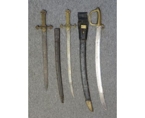 the first of regulation type, with broad straight blade and brass hilt cast in low relief; the second with associated curved 