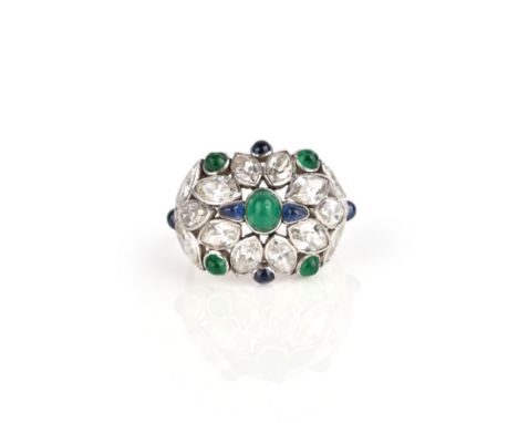 An early 20th century diamond, sapphire and emerald ring, of bombé design, set with marquise-shaped diamonds, cabochon emeral