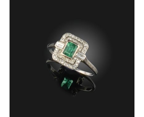 An Art Deco emerald and diamond ring, 1920s, collet-set with a step-cut emerald within a geometric mount set with single-cut 