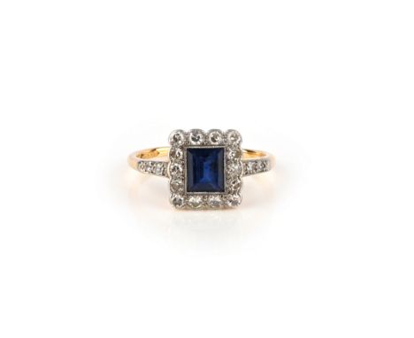 A sapphire and diamond set gold ring, early 20th century, set with a step-cut sapphire, within a millegrain-set border of sin