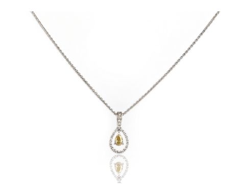 A fancy and white diamond pendant, the pear-shaped fancy-coloured diamond weighs approximately 0.70cts and suspends within a 