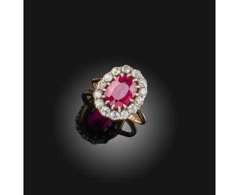 A synthetic ruby and diamond set gold cluster ring, early 20th century, set with an oval synthetic ruby within a border of cu