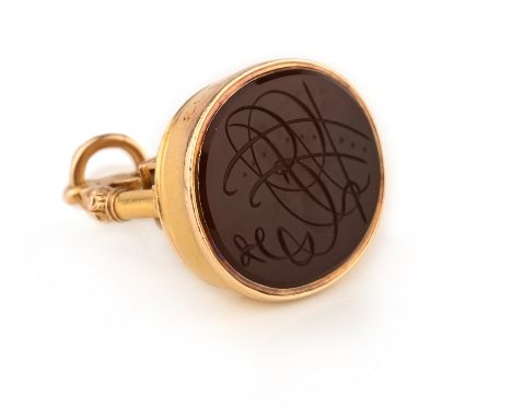 A Masonic fob seal, the mount designed as a book, square and compass on a pedestal, beneath an arch culminating in an eye, to
