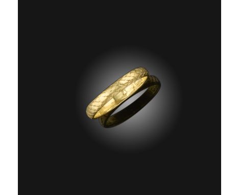 A gold posy ring, circa 1700, the exterior engraved with a skull and a scale pattern, the interior inscribed 'In thy breast m