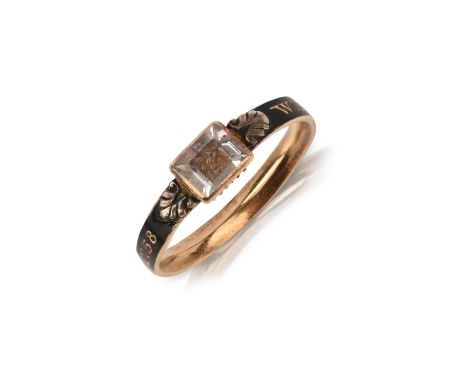 An early 18th century rock crystal and enamel gold mourning ring, the rectangular-shaped rock crystal above woven hair, on a 