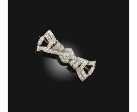 An early 20th century diamond bow brooch by Wendt's, of stylised design set with graduated circular-cut diamonds in palladium