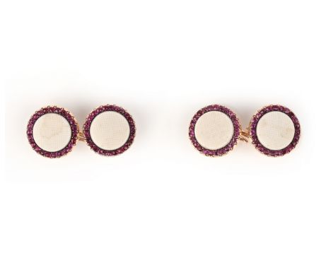 A pair of French ruby and white ceramic-mounted gold cufflinks, the white discs with crosshatch decoration, within a surround