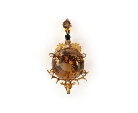A Victorian Scottish citrine pendant/brooch, designed as a stag's head, its antlers supporting a large circular-cut citrine w