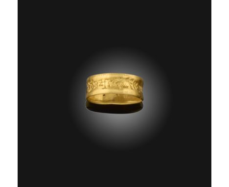 A late medieval gold posy ring, 15th century, the wide band carved with delicate sprays of wildflowers and an indistinct 'Bla