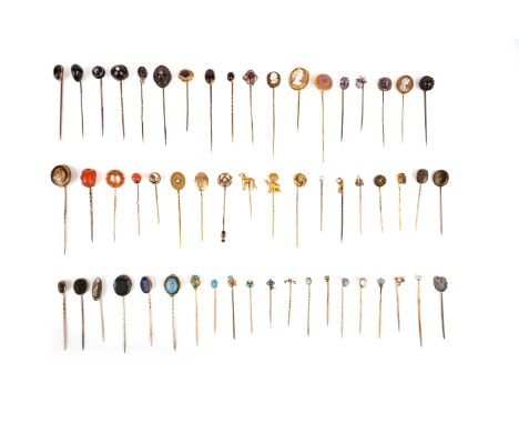 λ A group of 56 stick pins, late 19th/early 20th century, comprising: two set with moonstones; three set with amethysts; two 