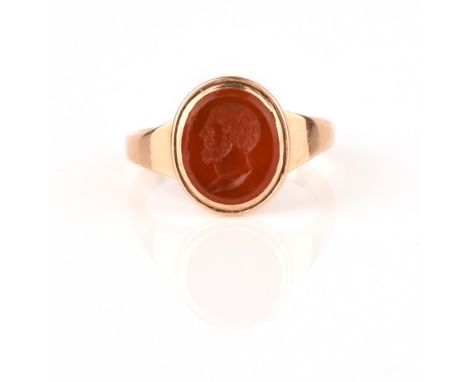 An 18th century carnelian intaglio ring, depicting Hercules in profile, with later gold shank, size Q 1/2