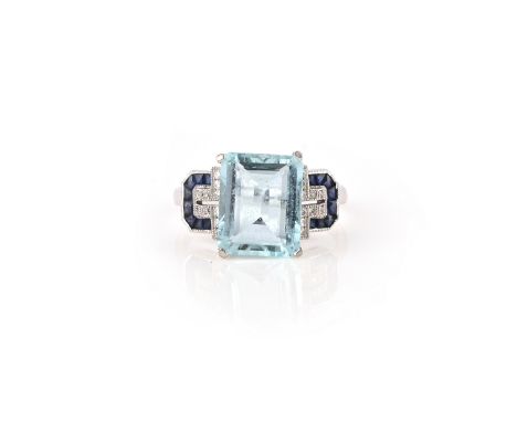 An aquamarine, sapphire and diamond ring, set with a step-cut aquamarine, to geometric shoulders with millegrain borders set 