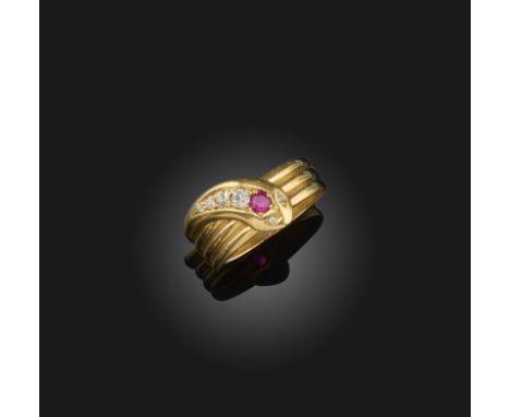 A Victorian ruby and diamond snake ring, set with graduated diamonds and a ruby in yellow gold, Birmingham hallmarks for 1863