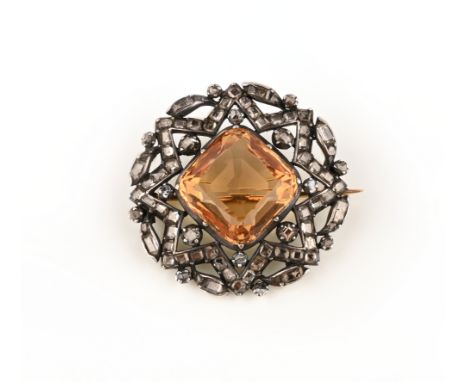 A late 18th century topaz and diamond brooch, set with a central square cushion-shaped orange topaz within a star-shaped and 