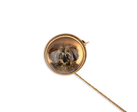 A gold and rock crystal reverse intaglio brooch, late 19th century, of circular outline with a rope twist border, set with a 