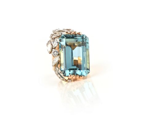 A mid 20th century aquamarine and diamond ring, the emerald-cut aquamarine weighs approximately 40.00cts, decorated with marq