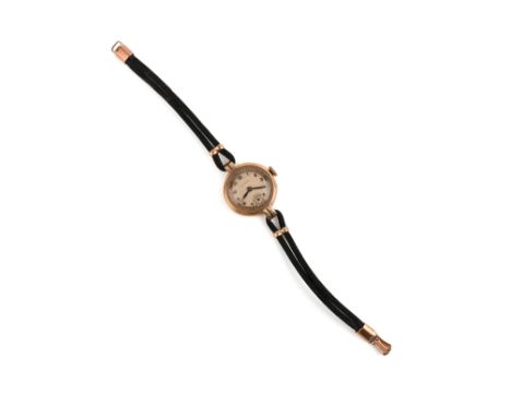 A lady's 9ct gold Rolex, mid 20th century, the circular silvered dial with blue steel hands, to a plain circular bezel and bl