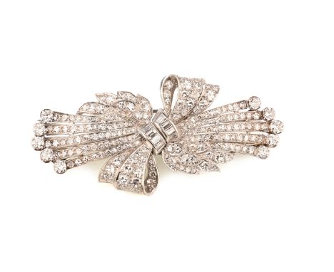 A mid 20th century diamond double clip brooch, designed as a stylised posy tied with a bow, set with graduated circular-cut d