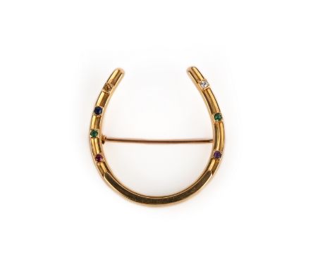 A late Victorian acrostic pendant, late 19th century, of horseshoe design, set with a sequence of circular-cut stones includi