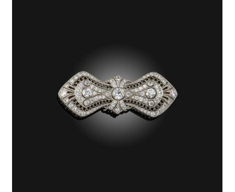 An American Belle Époque diamond set platinum brooch, Gorham, circa 1910, designed as a abstract bow in intricate openwork, s