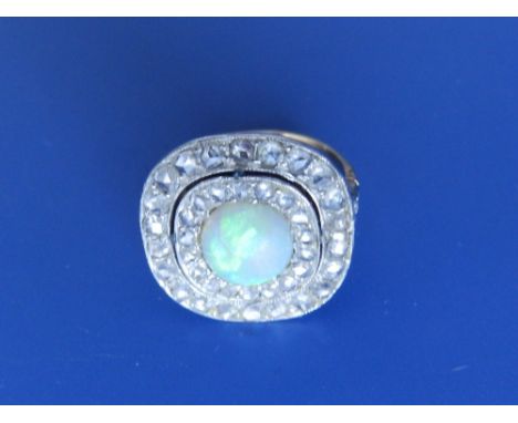 An opal & diamond target cluster ring.