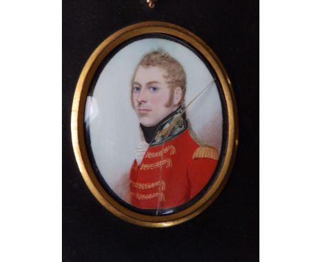A George III oval watercolour miniature portrait depicting an officer in scarlet jacket – possibly a member of the Armstrong 