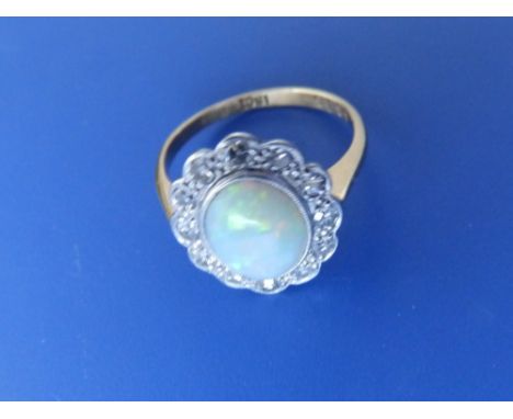 An opal & diamond cluster ring.