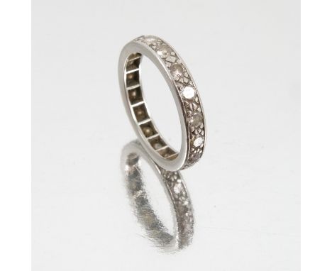 A diamond full eternity ring, the white mount unmarked, the eighteen brilliant cuts totalling approximately 1.1 carats, finge