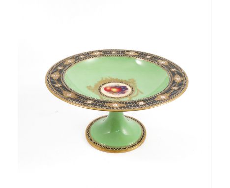 A Royal Worcester comport, the centre painted with fruit by W Bee, with green border and black and gold edge, raised on a ped