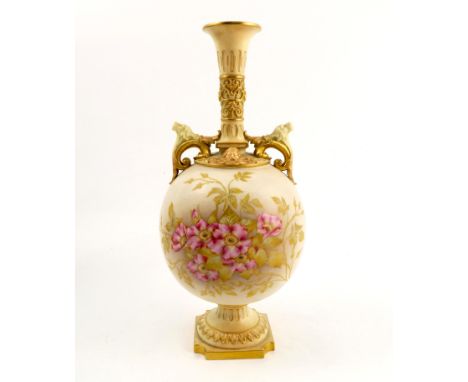 A Royal Worcester blush ivory vase, decorated with floral sprays, the pair of handles with dog masks, raised on a pedestal wi