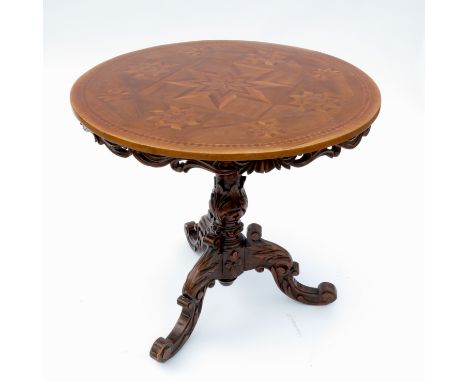 A 19th century occasional table, with a specimen parquetry inlaid top raised on a carved tripod base, diameter 31.5ins