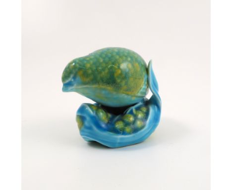 A Royal Worcester netsuke, modelled as a blue/green quail, dated circa 1957, possible restoration to leaf, height 2ins   Cond