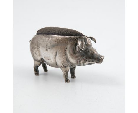 An Edwardian hallmarked silver pin cushion, formed as a pig   Condition report:  Possible repairs to all legs, split to head,