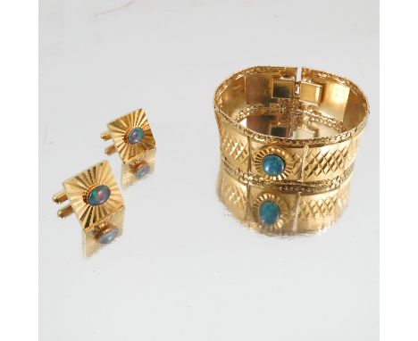 A pair of opal doublet cufflinks, a similarly set bracelet, a 9 carat gold garnet ring, three other rings and a chain