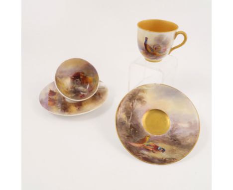 A Royal Worcester cabinet cup and saucer, the exterior of the cup and the saucer decorated with a cock and hen pheasant in la