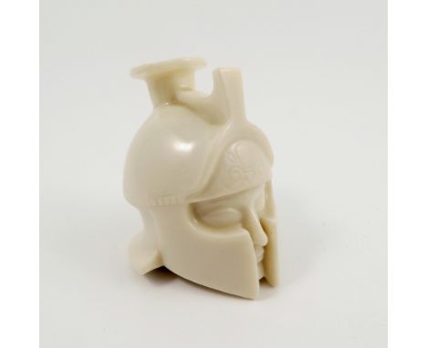 A Royal Worcester porcelain inkwell, modelled as a Roman helmet and face, inscribed to base Copied from a helmeted head found