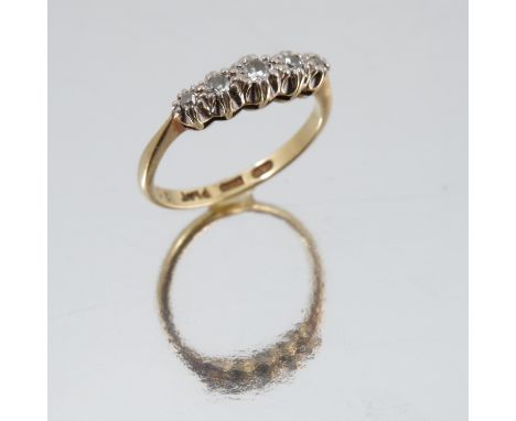 An 18ct gold five stone diamond ring