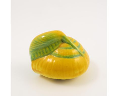 A Royal Worcester netsuke, modelled as a yellow and green snail, shape number 2665, dated circa 1932, height 1.25ins   Condit