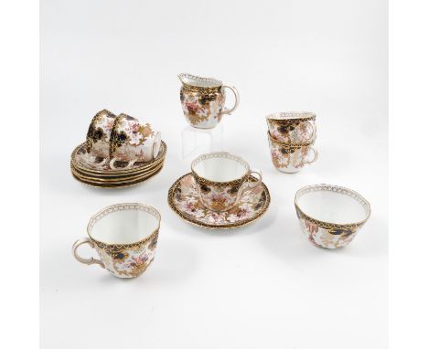 A Royal Crown Derby part tea service, decorated in a version of the Imari pattern, comprising six tea cups, six saucers, milk