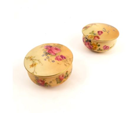 Two Royal Worcester blush ivory covered circular pots, both decorated with floral sprays, dated circa 1917, diameter 2.75ins 